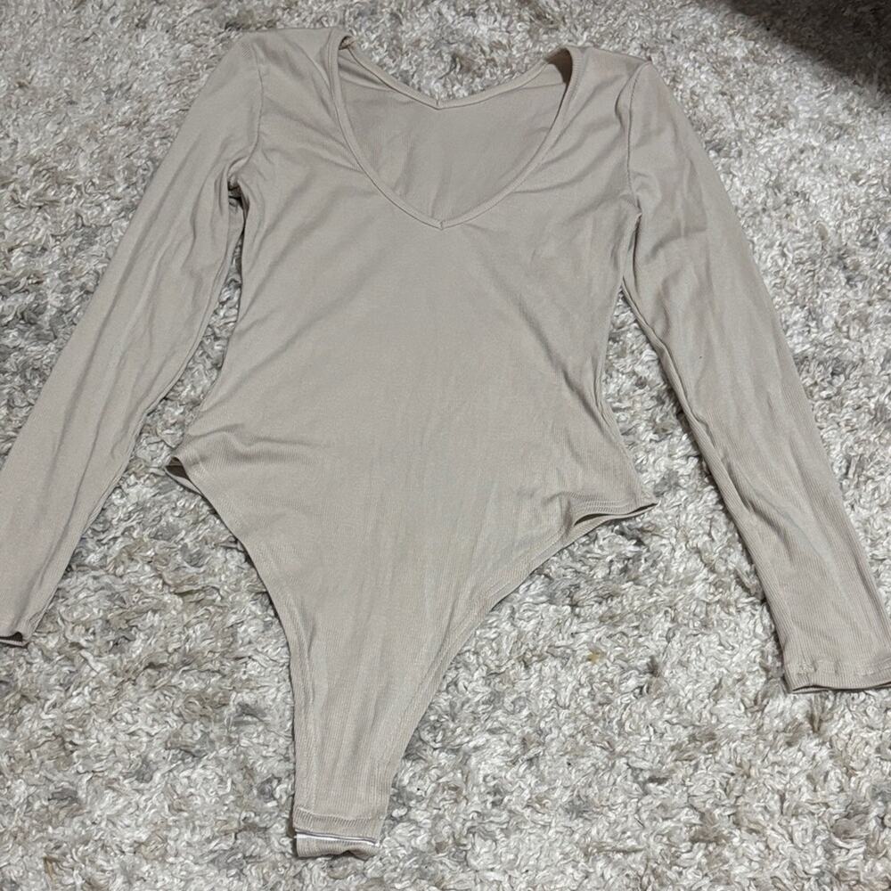 Women’s Beige Long Sleeve Bodysuit medium NWOT.